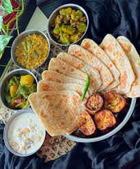 Traditional Bangladeshi breakfast with paratha and dal