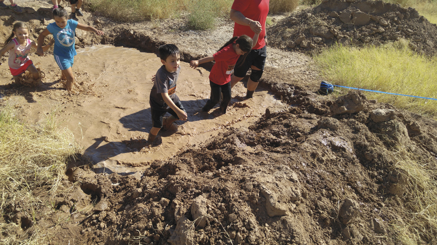 Village children racing on muddy fields